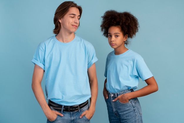 Stylish teen boy and girl posing