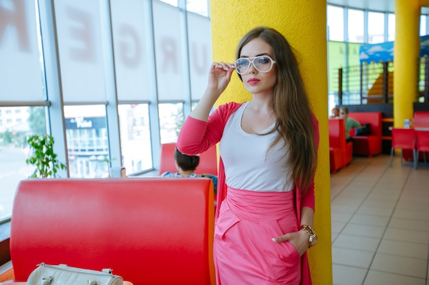 Free photo stylish teenager posing with white glasses