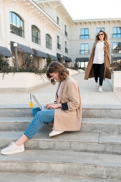 Stylish teenagers relaxing outdoors