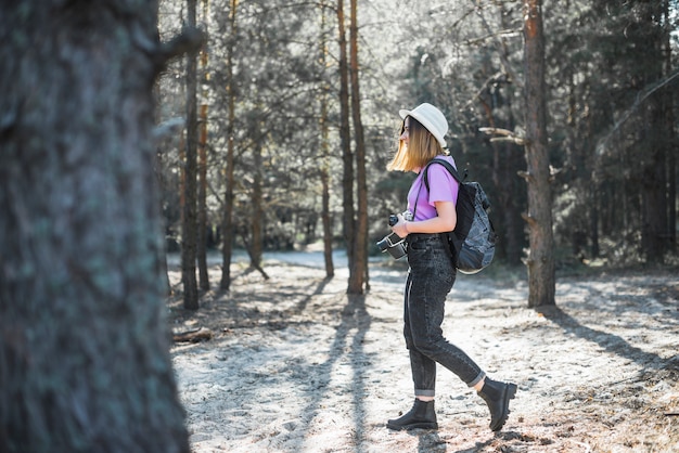 Stylish traveller with camera