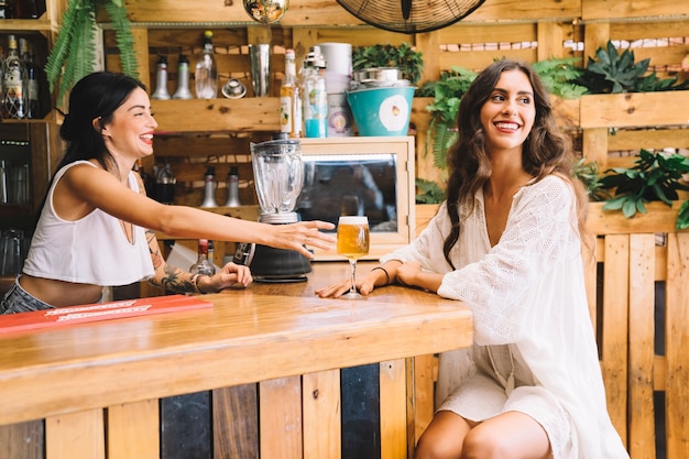 Stylish woman and bartender