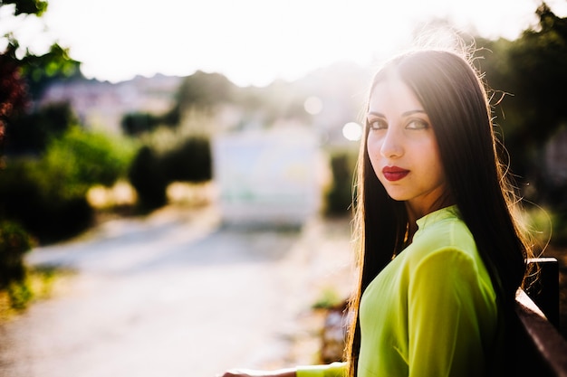 Stylish woman on bench