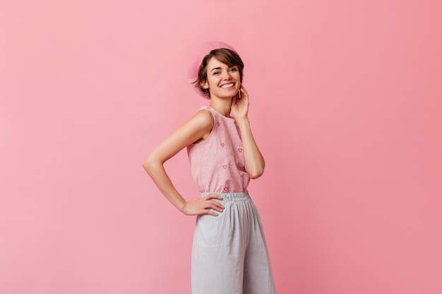 Stylish woman in pants looking at front