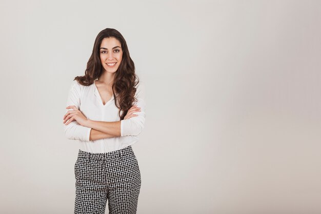 Stylish woman posing with crossed arms