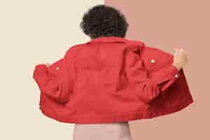 Free photo stylish woman in red denim jacket for apparel shoot rear view