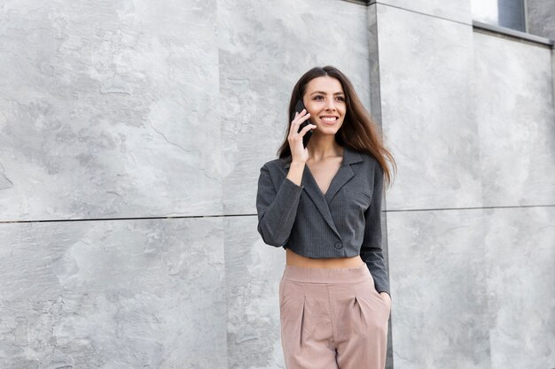 Stylish woman relaxing in a clean urban space