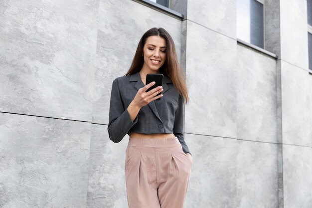 Stylish woman relaxing in a clean urban space