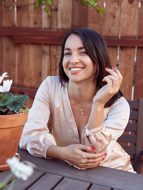 Stylish Woman Smoking a Joint Outside