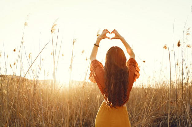 Stylish woman spending time in a summer field