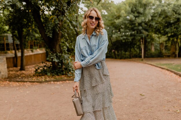 Stylish woman walking in park