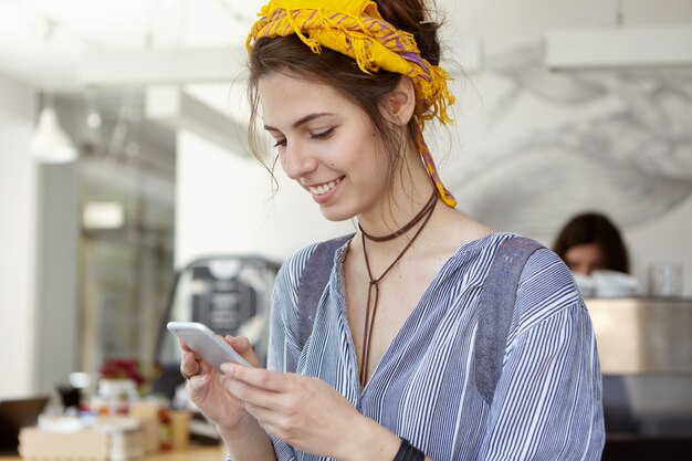 Stylish woman wearing yellow bandana