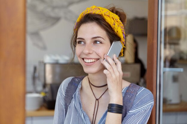 Stylish woman wearing yellow bandana