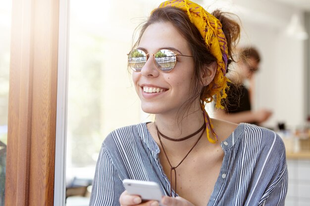 Stylish woman wearing yellow bandana