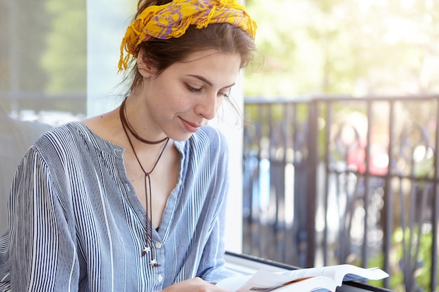 Stylish woman wearing yellow bandana