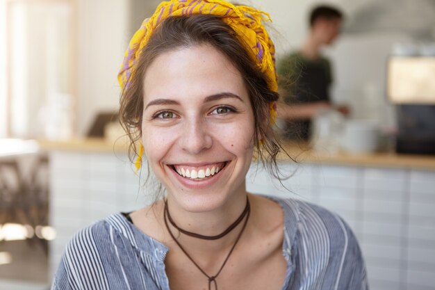 Stylish woman wearing yellow bandana