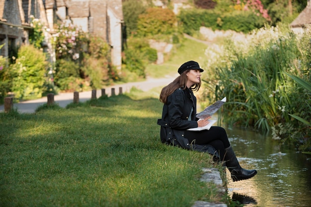 Stylish woman with map for traveling