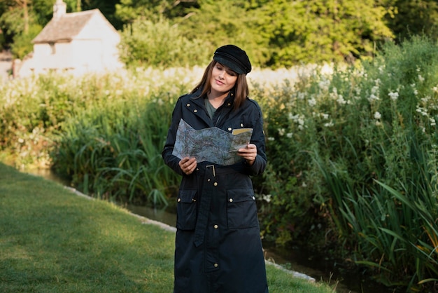 Stylish woman with map for traveling