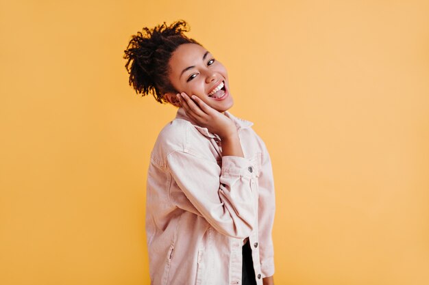 Stylish woman with ponytail looking at front