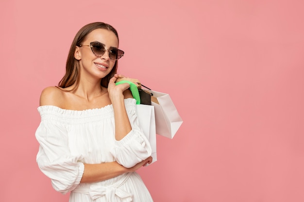 Free photo stylish woman with shopping bags