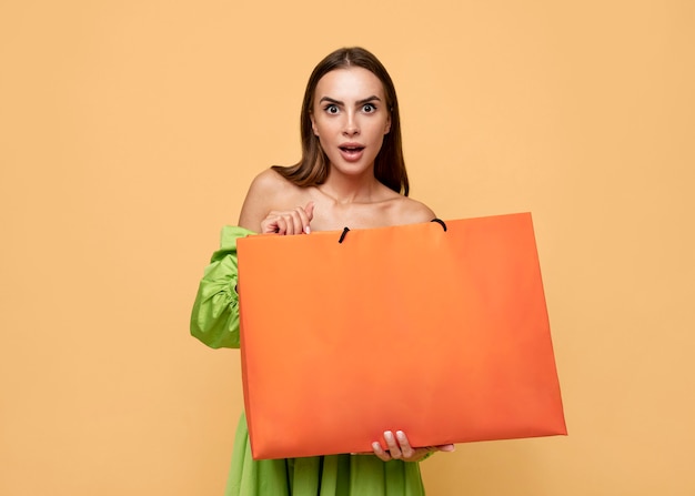 Free photo stylish woman with shopping bags