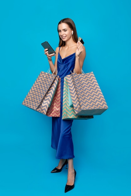 Free photo stylish woman with shopping bags