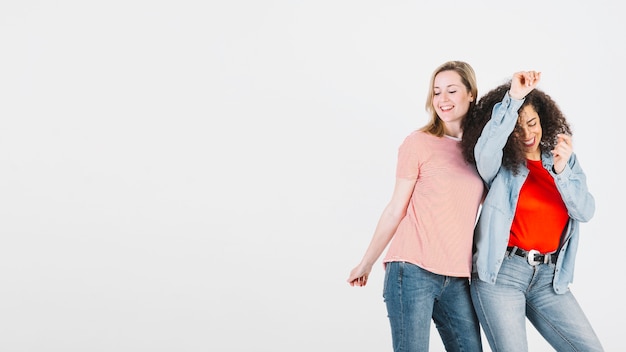 Stylish women dancing together