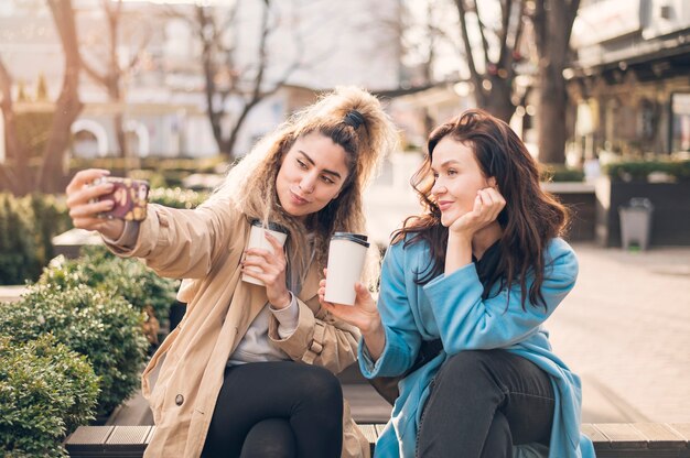 Stylish young girl talking pictures together