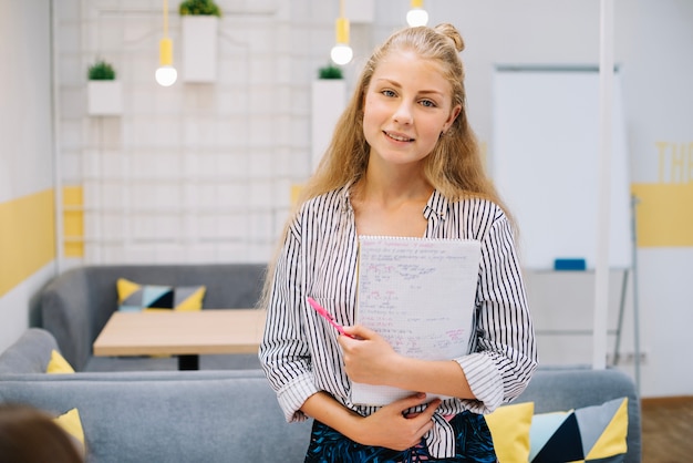 Stylish young girl with studies