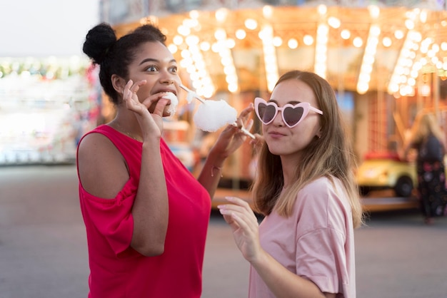 Free photo stylish young girls having fun together