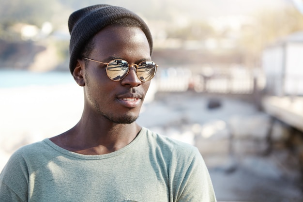 Stylish young man at the beach