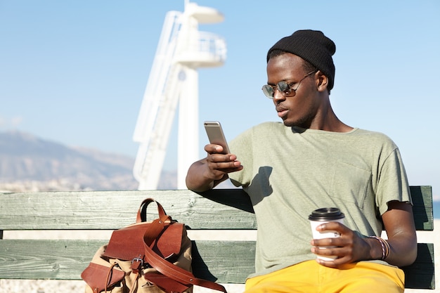 Stylish young man at the beach