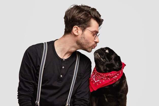 Stylish young man and his cute dog