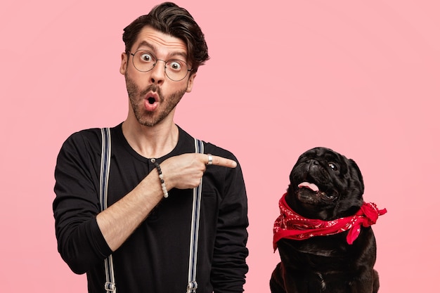 Stylish young man and his cute dog