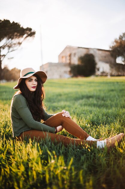 Stylish young model on grass