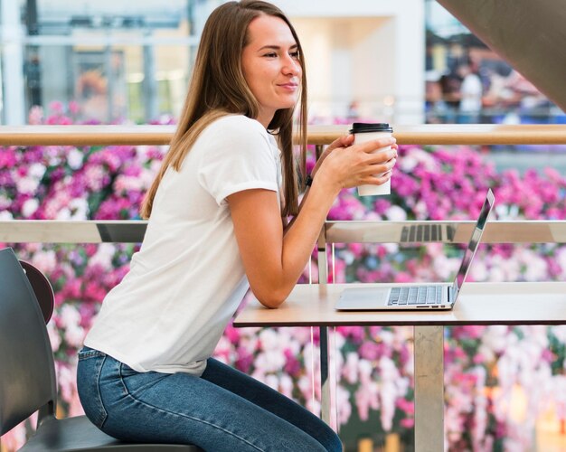 Stylish young woman enjoying coffee