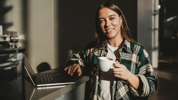 Stylish young woman enjoying coffee