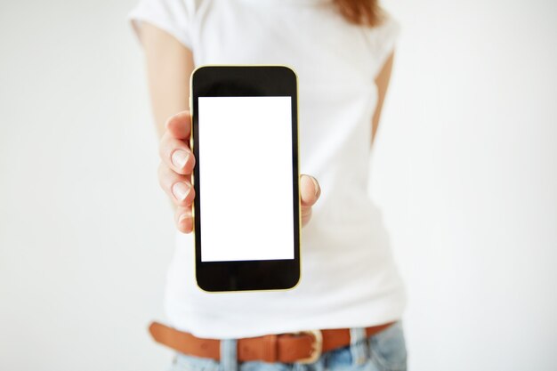 Stylish young woman holding smartphone