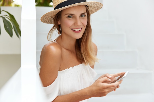 Stylish young woman posing on stairs