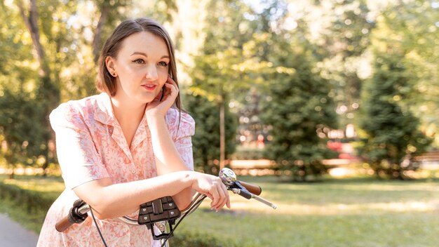 Stylish young woman relaxing outdoors