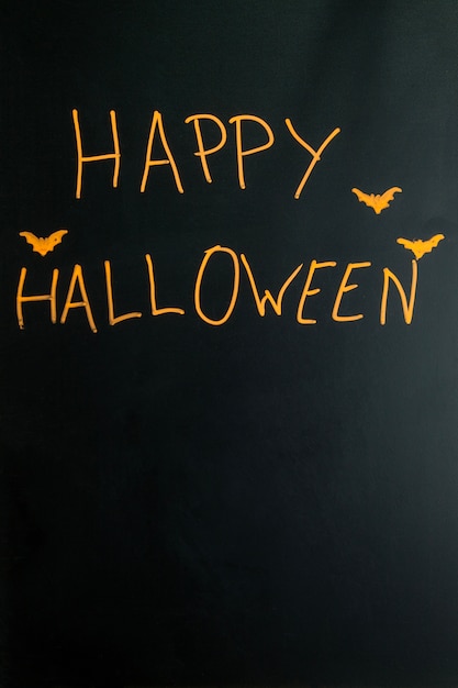 Стилизованная счастливая подпись Хэллоуина с летучими мышами