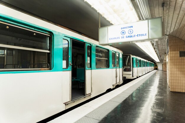 Subway train stopped in the station with opened doors