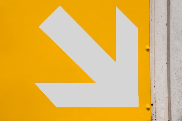 Subway white arrow on yellow background