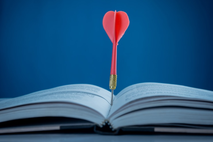 Free Photo success concept,  target on book