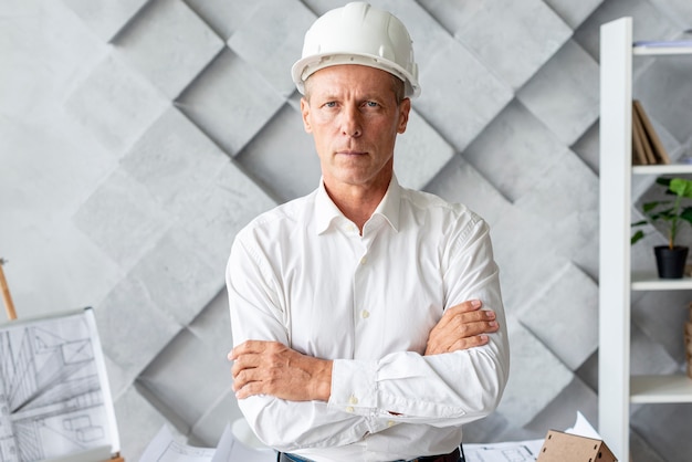 Successful architect with safety helmet