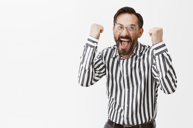 Successful bearded mature man posing