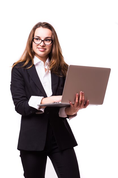 Successful business woman is standing on isolated wall.