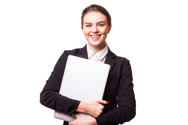 Successful business woman is standing on isolated white wall.