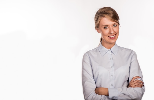 Successful business woman with arms crossed - isolated over whit