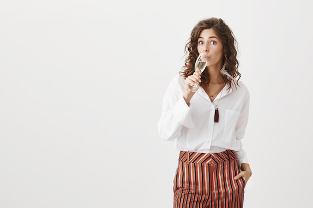 Free photo successful businesswoman drinking glass champagne