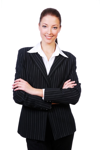 Free photo successful cute businesswoman with crossed arms standing on white